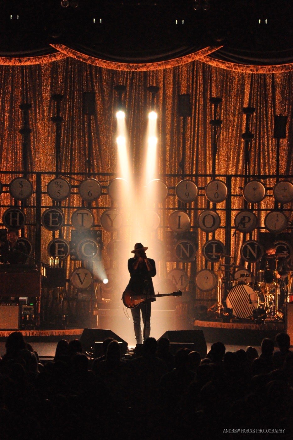 Performer silhouetted on the Township Auditorium stage